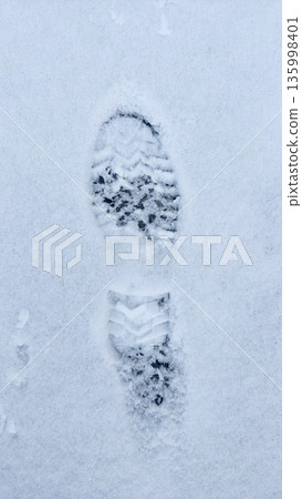 Footprints in the snow under the ski lift Footprints in the snow under the ski lift 135998401