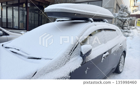 Snow piled up on the windshield of a car - Snow country scenery 135998460