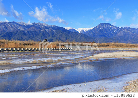 Azumino in winter: The frozen Hodaka River and the Northern Alps 135999628