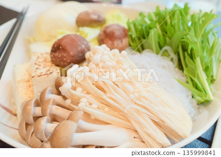 Assorted ingredients for hot pot (mushrooms, tofu, vegetables) 135999841