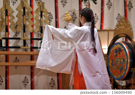 Kagura offering: Shrine maiden dancing the bell dance Kagura offering: Shrine maiden dancing the bell dance 136000490