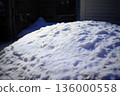 Snow piled up on a residential property and everyday winter scenery 136000558