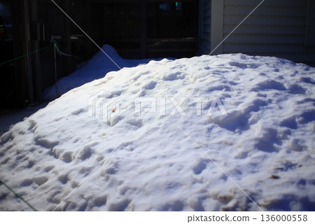 Snow piled up on a residential property and everyday winter scenery Snow piled up on a residential property and everyday winter scenery 136000558