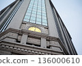 Modern building facade and cityscape with clock 136000610