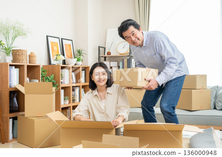 A middle-aged couple moving 136000948