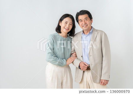 A middle-aged couple on a date on a white background A middle-aged couple on a date on a white background 136000970
