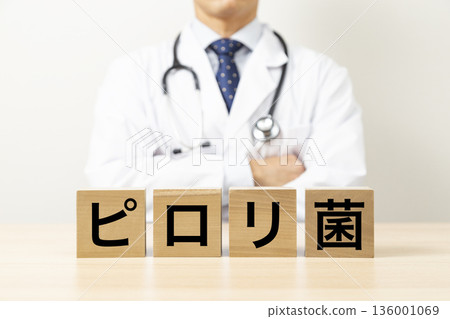 A block with "Helicobacter pylori" written on it and a doctor A block with "Helicobacter pylori" written on it and a doctor 136001069