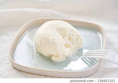 Burrata cheese that can be cut open to reveal the inside Burrata cheese that can be cut open to reveal the inside 136001101