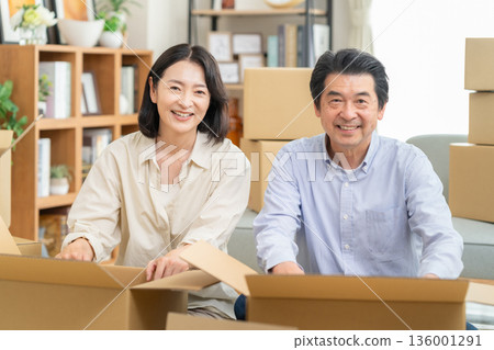 A middle-aged couple moving 136001291