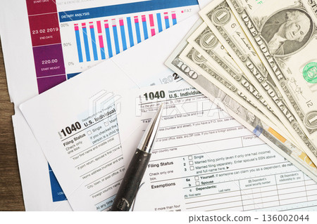 Tax form 1040 U.S. Individual Income Tax Return, business finance concept. Tax form 1040 U.S. Individual Income Tax Return, business finance concept. 136002044
