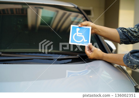 Wheelchair sticker sign on car for safety travel. 136002351