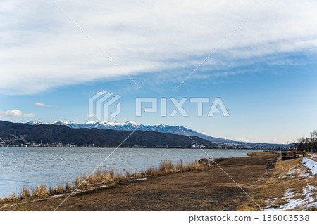 Snow-covered Yatsugatake seen from Lake Suwa Snow-covered Yatsugatake seen from Lake Suwa 136003538