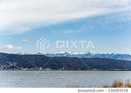 Snow-covered Yatsugatake seen from Lake Suwa Snow-covered Yatsugatake seen from Lake Suwa 136003539