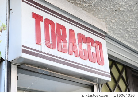 The red lettering of "TOBACCO" on the sign exudes a Showa-era retro atmosphere. The red lettering of "TOBACCO" on the sign exudes a Showa-era retro atmosphere. 136004036