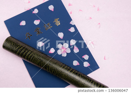 Graduation certificate and cherry blossom petals graduation ceremony 136006047