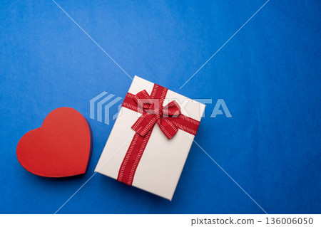Gift and heart on blue background, thank you gift Gift and heart on blue background, thank you gift 136006050