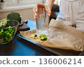 Preparation of smashed broccoli with cheese for a healthy meal 136006214