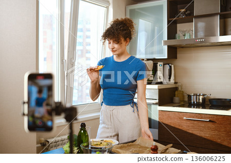 A food blogger records a video of cooking smashed broccoli with cheese A food blogger records a video of cooking smashed broccoli with cheese 136006225