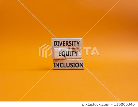 Diversity Equity Inclusion symbol. Concept words Diversity Equity Inclusion on wooden blocks. Beautiful orange background. Business and Diversity Equity Inclusion concept. Copy space Diversity Equity Inclusion symbol. Concept words Diversity Equity Inclusion on wooden blocks. Beautiful orange background. Business and Diversity Equity Inclusion concept. Copy space 136006340