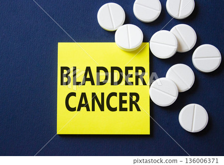 Bladder Cancer symbol. Concept word Bladder Cancer on yellow note. Beautiful deep blue background with pills. Medicine and Bladder Cancer concept. Copy space 136006371