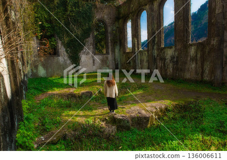 The ruins of the Chinda Power Plant and a woman 136006611