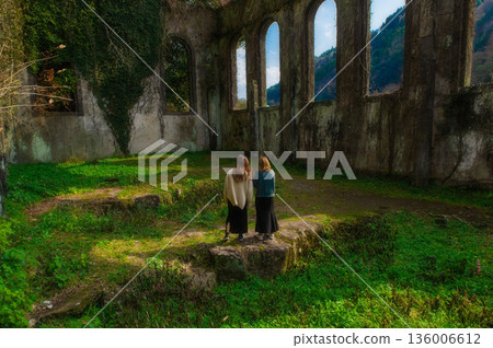 The ruins of the Chinda Power Plant and a woman The ruins of the Chinda Power Plant and a woman 136006612