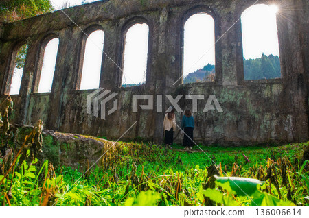 The ruins of the Chinda Power Plant and a woman 136006614
