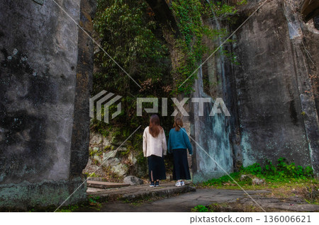 The ruins of the Chinda Power Plant and a woman The ruins of the Chinda Power Plant and a woman 136006621
