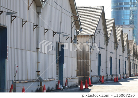 Streetscape with many warehouse buildings 136007250