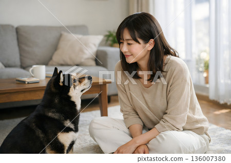 Peaceful indoor time exchanging glances with your dog 136007380