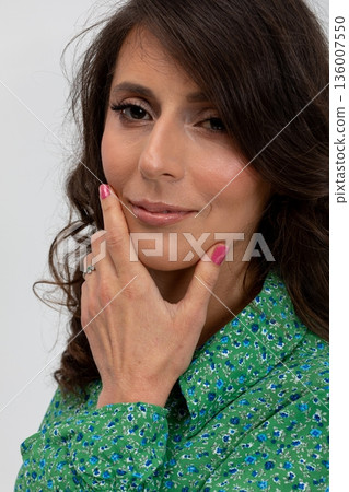 Woman examining product, Professional woman with gentle smile and subtle fashion details, Studio shot capturing thoughtful woman assessing ideas with calm confidence and style Woman examining product, Professional woman with gentle smile and subtle fashion details, Studio shot capturing thoughtful woman assessing ideas with calm confidence and style 136007550