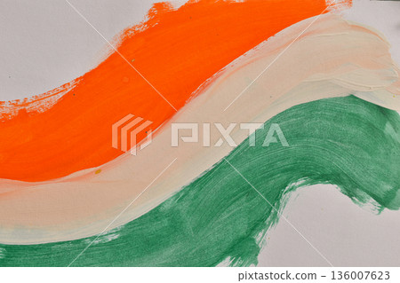 Abstract watercolor brushstrokes of orange and green on a white background, representing the colors of the Indian flag. Festive art, perfect for national holidays. 136007623