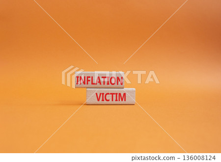 Inflation Victim symbol. Wooden blocks with words Inflation Victim. Beautiful orange background. Business and Inflation Victim concept. Copy space. Inflation Victim symbol. Wooden blocks with words Inflation Victim. Beautiful orange background. Business and Inflation Victim concept. Copy space. 136008124