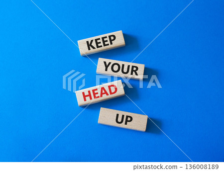 Keep Your Head Up symbol. Concept words Keep Your Head Up on wooden blocks. Beautiful bright blue background. Business and Keep Your Head Up concept. Copy space. Keep Your Head Up symbol. Concept words Keep Your Head Up on wooden blocks. Beautiful bright blue background. Business and Keep Your Head Up concept. Copy space. 136008189