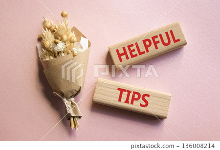 Helpful tips symbol. Wooden blocks with words Helpful tips. Beautiful pink background with bouquet of flowers. Business and Helpful tips concept. Copy space. Helpful tips symbol. Wooden blocks with words Helpful tips. Beautiful pink background with bouquet of flowers. Business and Helpful tips concept. Copy space. 136008214