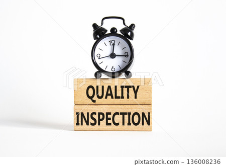 Quality Inspection symbol. Concept word Quality Inspection on wooden blocks. Beautiful white background with alarm clock. Business and Quality Inspection concept. Copy space 136008236