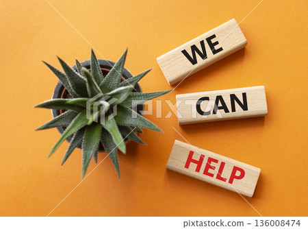 We can help symbol. Wooden blocks with words We can help. Beautiful orange background with succulent. Business and We can help concept. Copy space. 136008474