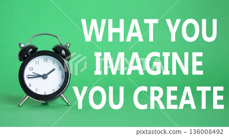 What you Imagine you Create you symbol. Wooden blocks with words What you Imagine you Create. Beautiful green background with alarm clock. What you Imagine you Create concept. Copy space. 136008492