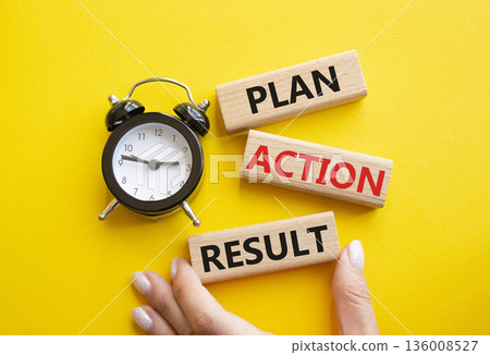 Plan Action Result symbol. Concept words Plan Action Result on wooden blocks. Businessman hand. Beautiful yellow background with alarm clock. Business concept and Plan Action Result. Copy space. 136008527