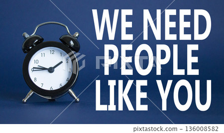 Hiring symbol. Wooden blocks with words We need People like You. Beautiful deep blue background with alarm clock. Business and Hiring concept. Copy space. 136008582