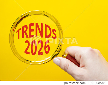 Trends 2026 symbol. Magnifying Glass with words Trends 2026. Businessman hand. Beautiful yellow background. Business and Trends 2026 concept. Copy space. Trends 2026 symbol. Magnifying Glass with words Trends 2026. Businessman hand. Beautiful yellow background. Business and Trends 2026 concept. Copy space. 136008585
