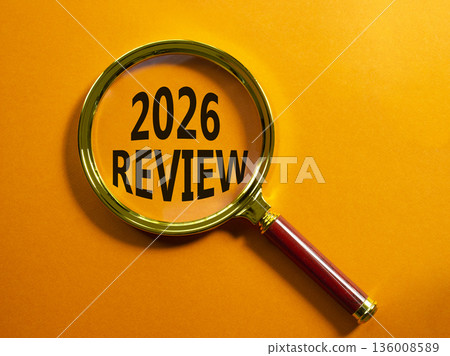 2026 Review symbol. Magnifying Glass with words 2026 Review. Beautiful orange background. Business and 2026 Review concept. Copy space. 136008589