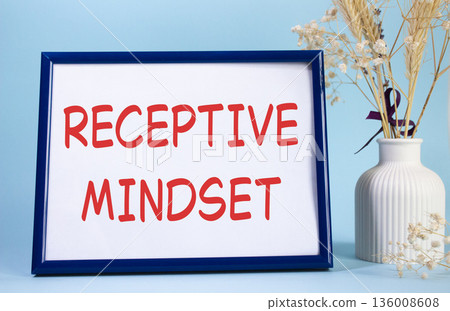 Receptive Mindset symbol. Concept words Receptive Mindset on beautiful wooden picture frame. Beautiful light blue background with flower vase. Business and Receptive Mindset concept. Copy space. Receptive Mindset symbol. Concept words Receptive Mindset on beautiful wooden picture frame. Beautiful light blue background with flower vase. Business and Receptive Mindset concept. Copy space. 136008608