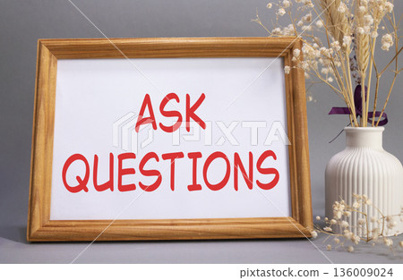 Ask Questions symbol. Concept words Ask Questions on beautiful wooden picture frame. Beautiful grey background with flower vase. Business and Ask Questions concept. Copy space. Ask Questions symbol. Concept words Ask Questions on beautiful wooden picture frame. Beautiful grey background with flower vase. Business and Ask Questions concept. Copy space. 136009024