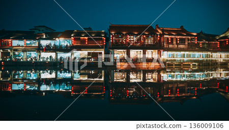 Nighttime View of Historic Buildings Reflecting on Calm Water Surface. Zhujiajiao, Shanghai, China Nighttime View of Historic Buildings Reflecting on Calm Water Surface. Zhujiajiao, Shanghai, China 136009106