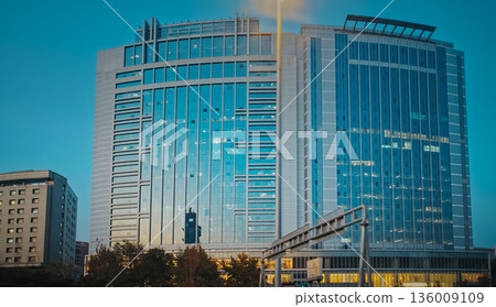 Beijing Dacheng Mansions. tall modern office tower illuminated against the twilight sky. Jinyu Building, Beijing Dacheng Mansions. tall modern office tower illuminated against the twilight sky. Jinyu Building, 136009109