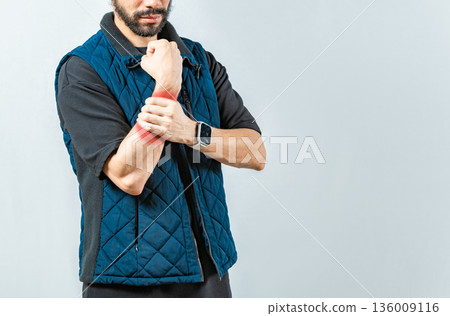 People with wrist pain isolated, Young man with pain in the hands, man with arthritis rubbing wrist 136009116