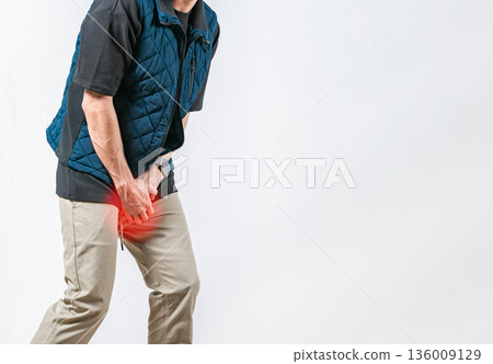 Urinary medical problem concept. Person with hands on crotch with urinary infection on isolated background Urinary medical problem concept. Person with hands on crotch with urinary infection on isolated background 136009129