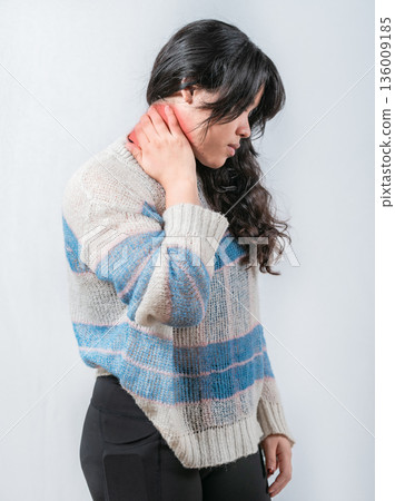 Asian woman with neck pain isolated. Suffering young woman with stress and neck pain Asian woman with neck pain isolated. Suffering young woman with stress and neck pain 136009185