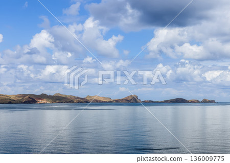 Panoramic Atlantic seascape from base to far tip of Point of Saint Lawrence Madeira rugged tip Panoramic Atlantic seascape from base to far tip of Point of Saint Lawrence Madeira rugged tip 136009775